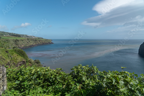 coastal view of the green hilly cliffs in the azores portugal