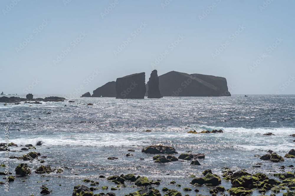 Black rocks in the middle of the sea at Sao Miguel island Azores. 