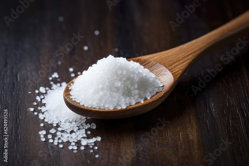 a wooden spoon with sugar or salt