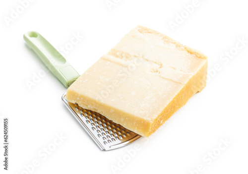 Tasty parmesan cheese and grater isolated on white background.