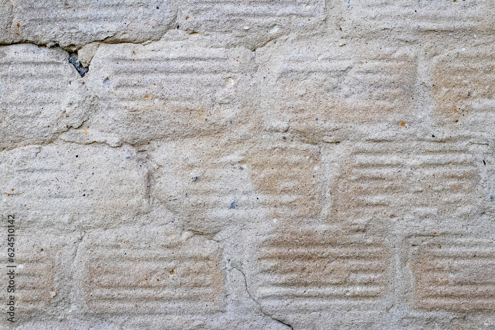 Texture of a concrete wall with traces of dismantled facing tiles Texture of a concrete wall with traces of dismantled facing tiles
