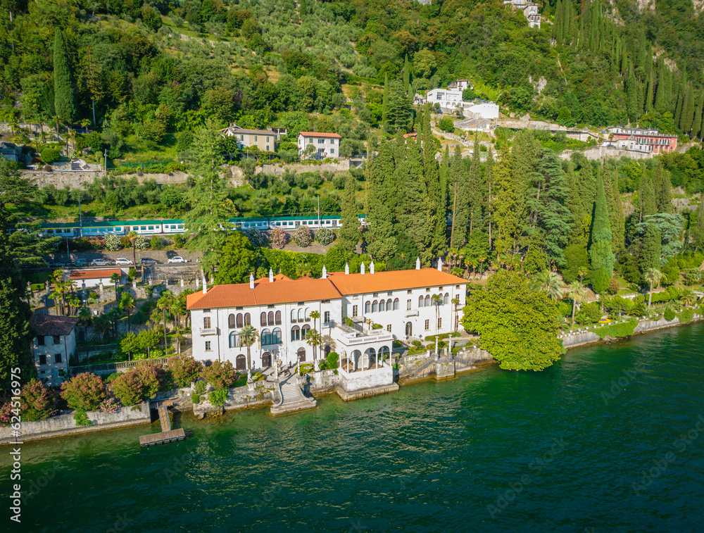 Aerial panoramic view of touristic villa Monastero located in Varenna resort, on the shore of lake Como, Lombardy region, Italy