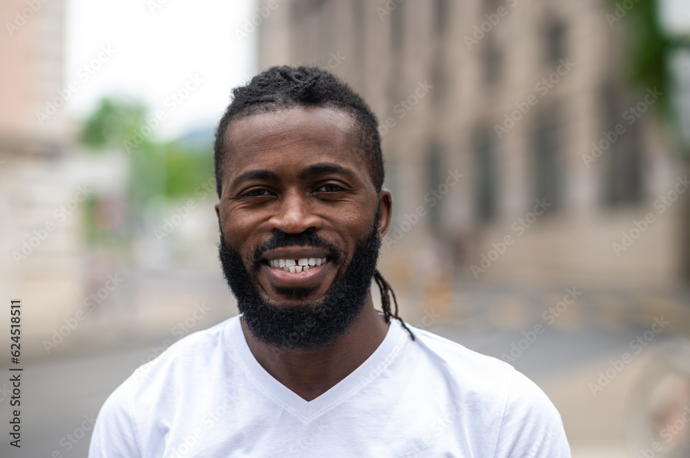 Portrait picture of a smiling dark-skinned handsome man Portrait picture of a smiling dark-skinned handsome man