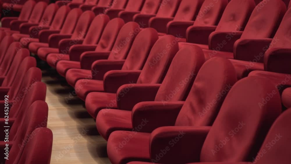 So many red empty cinema chairs