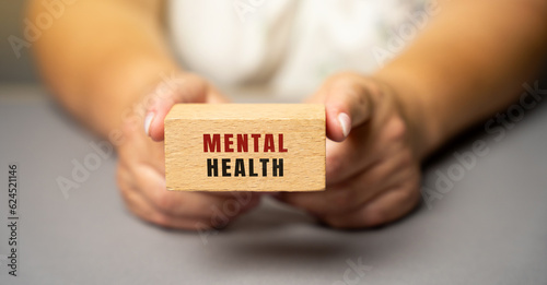 Fotografía Mental health on wooden blocks in female hands