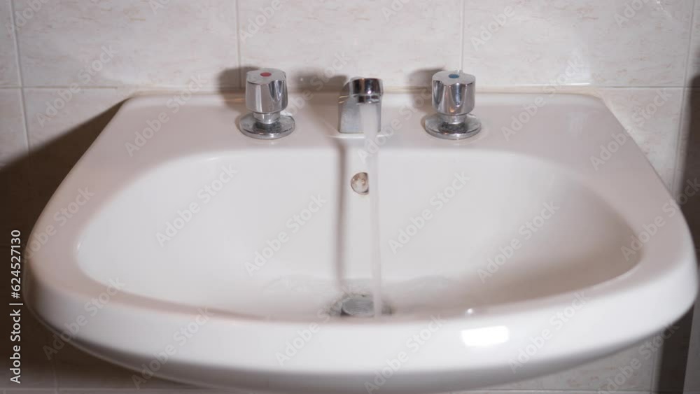 Bathroom faucet opens and lets water out Bathroom faucet opens and lets water out