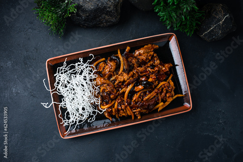 Chicken with sweet pepper, Shiitake mushrooms in honey sauce, asian cuisine.