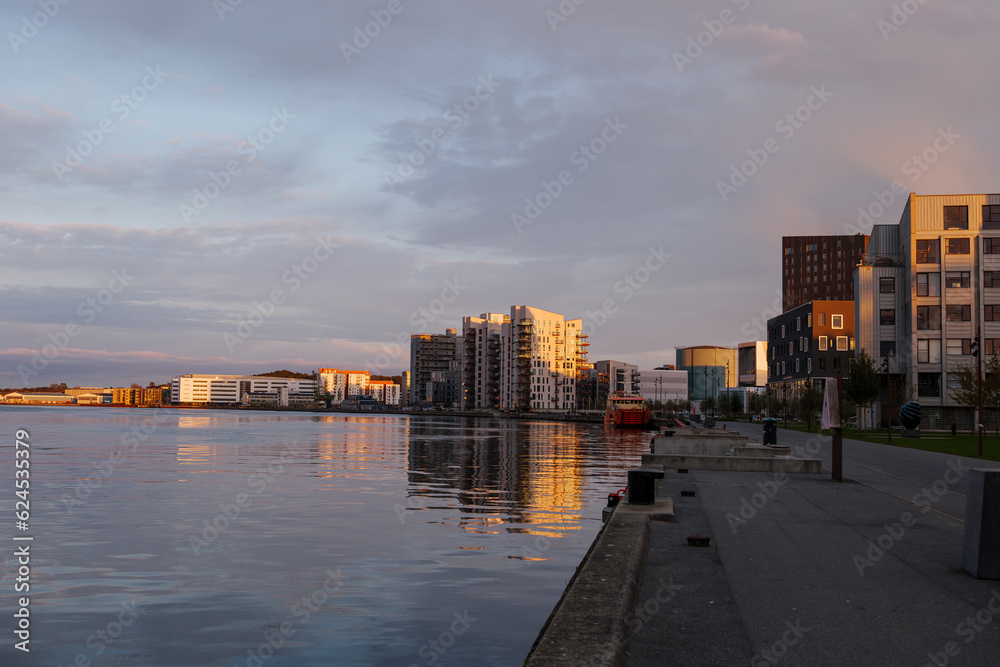 Outdoor landscape scenery during twilight on the waterfront in Aalborg, Denmark.