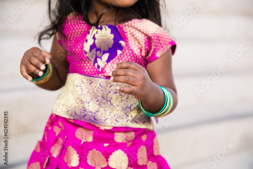 Photography close up of toddler little girl in indian sari dress with traditional jewelry br