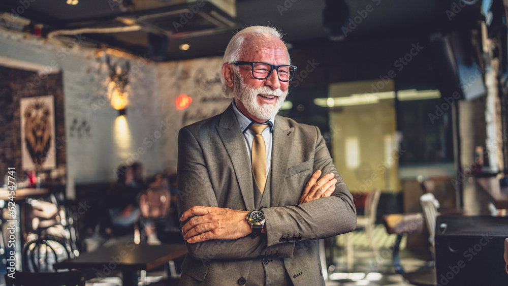 Portrait of one senior man businessman stand in cafe or restaurant Portrait of one senior man businessman stand in cafe or restaurant