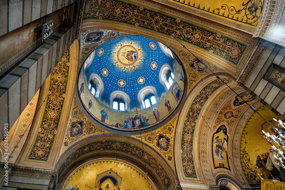 Richly-decorated interior of the Saint Spyridon Serbian-Orthodox church, erected in 18th century, with a dome and mosaics in Neo-Byzantine style, Trieste, Italy