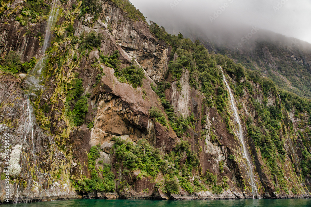 The world famous magical Milford Sound in the Fiordland national park  in stormy weather