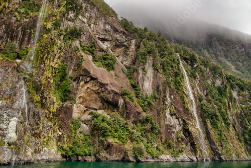 The world famous magical Milford Sound in the Fiordland national park in stormy weather