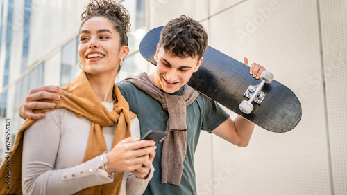 modern brother and sister or couple young man and woman walk outdoor