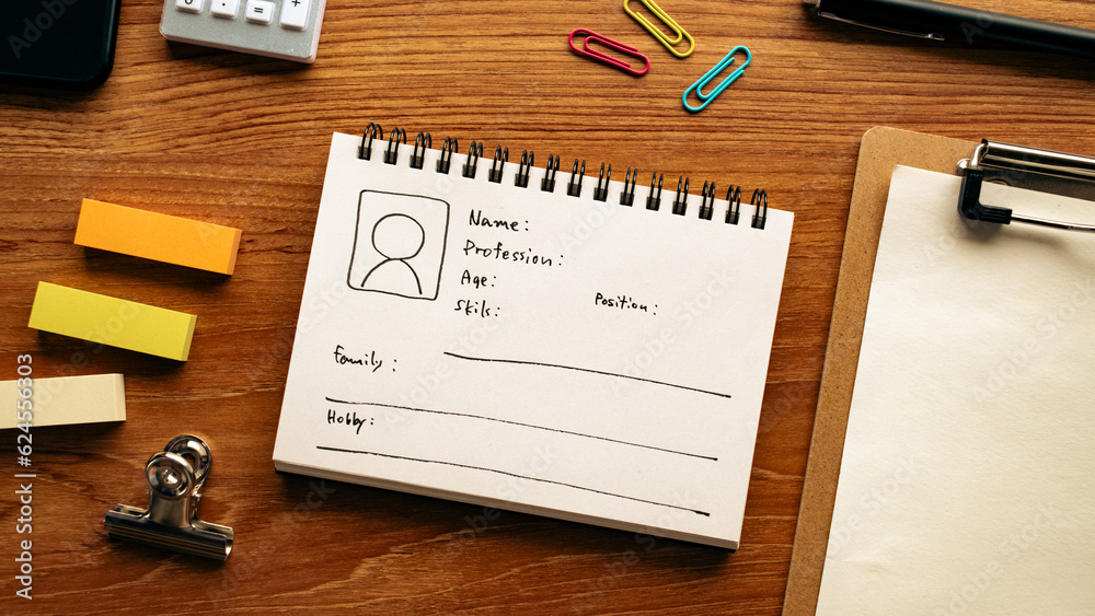 A notebook with a diagram of the persona is on the desk. A notebook with a diagram of the persona is on the desk.