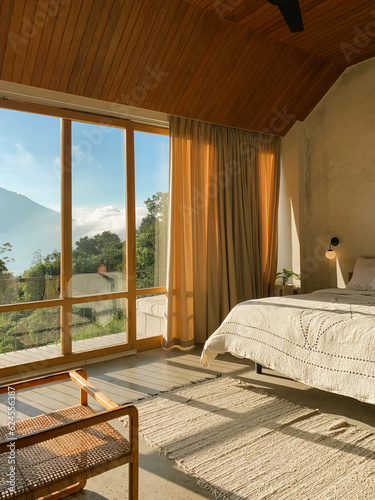Panoramic windows in  bedroom with stunning view © tashka2000