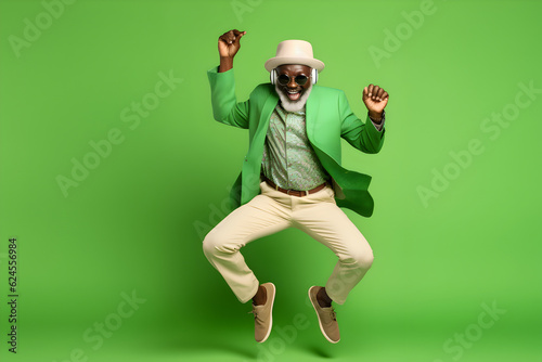 happy old stylisch black man jumping and dancing in front of a green background in a dress, generative ai