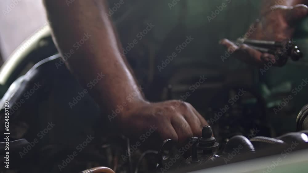 Bolts Removed from Old Car Engine in Repair Shop Footage. Bolts Removed from Old Car Engine in Repair Shop Footage.