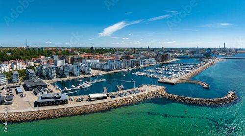 View of the Helsinborg city centre and the port of Helsingborg in Sweden. Old town by the beach and city port in Helsingborg harbour. Beautiful aerial view. © Aerial Film Studio