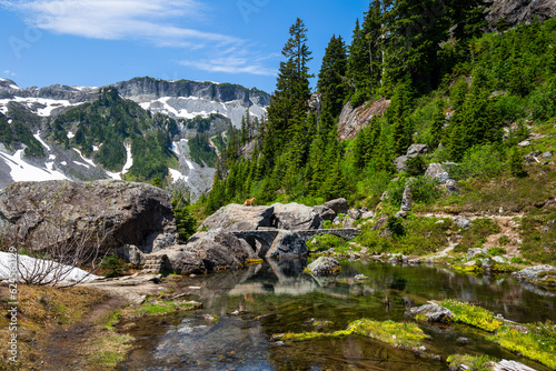 Serene Upper Bagley Lake with a rock bridge through the river photo