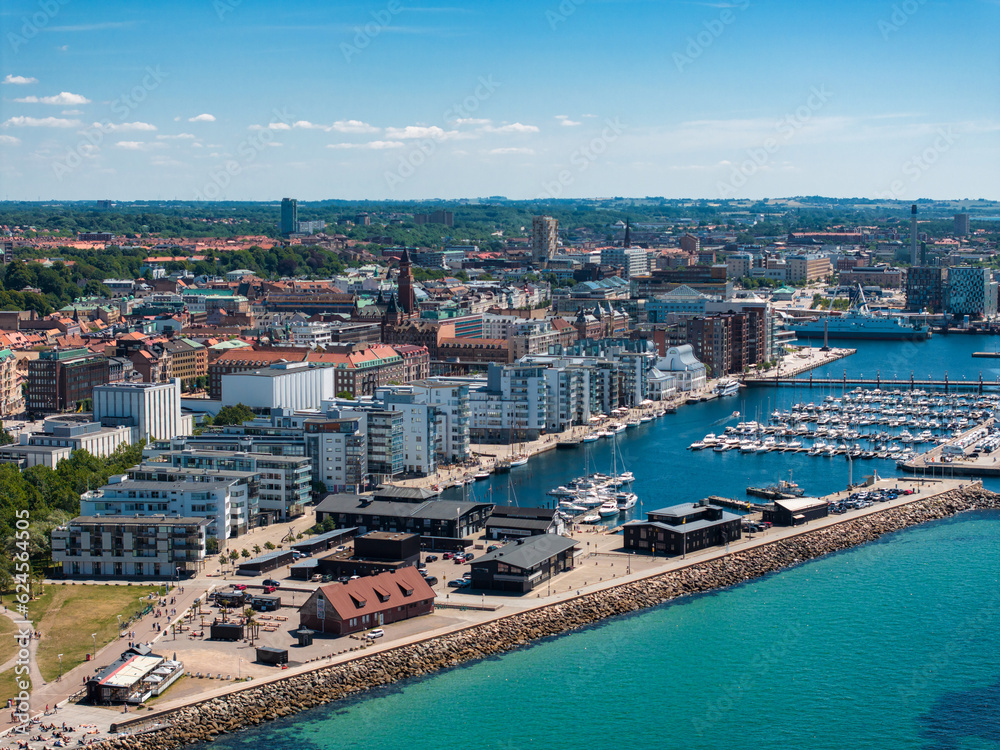 View of the Helsinborg city centre and the port of Helsingborg in Sweden. Old town by the beach and city port in Helsingborg harbour. Beautiful aerial view.