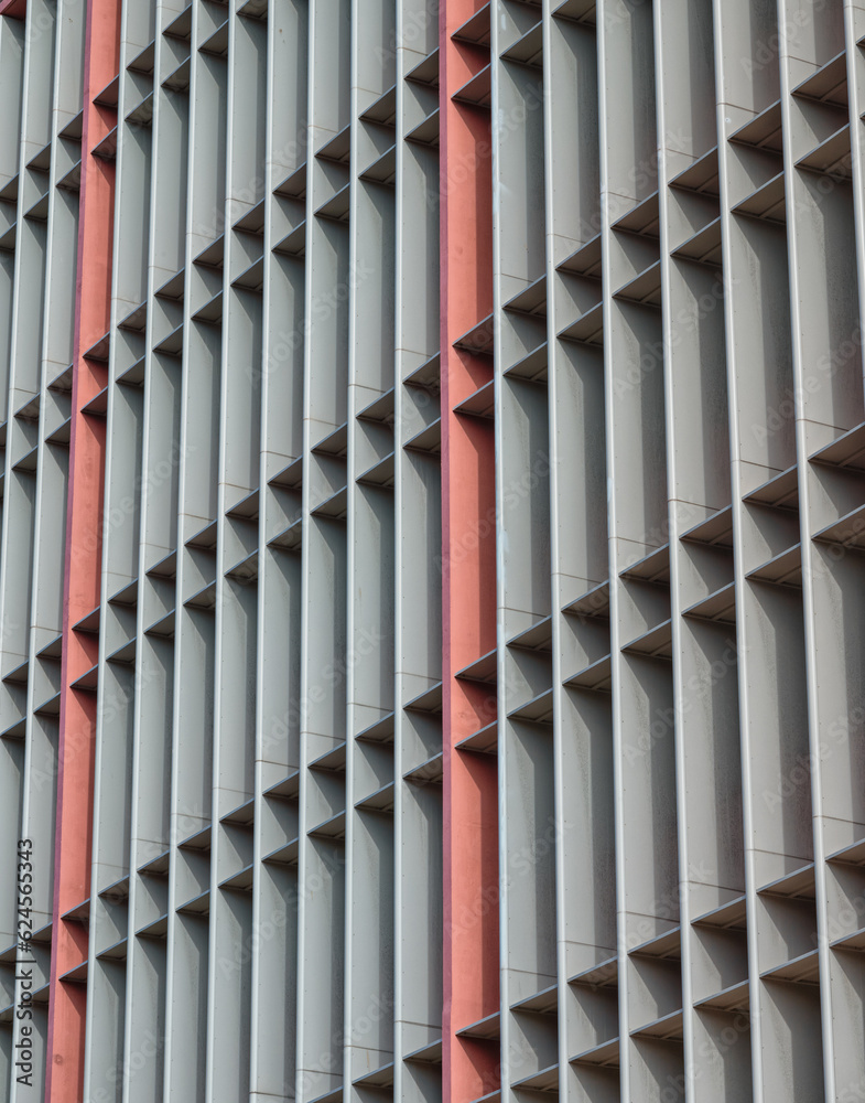 Charcoal and Pink Building Facade with Sunlight and Shadows. Charcoal and Pink Building Facade with Sunlight and Shadows.