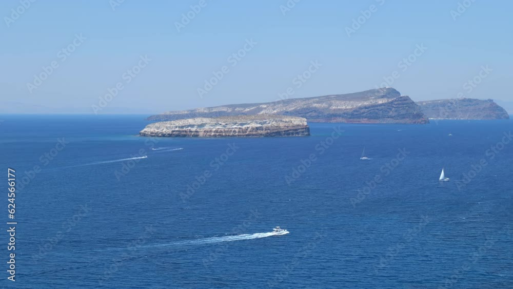 Blue Ocean and Aspronisi Island at the Caldera of Santorini Blue Ocean and Aspronisi Island at the Caldera of Santorini