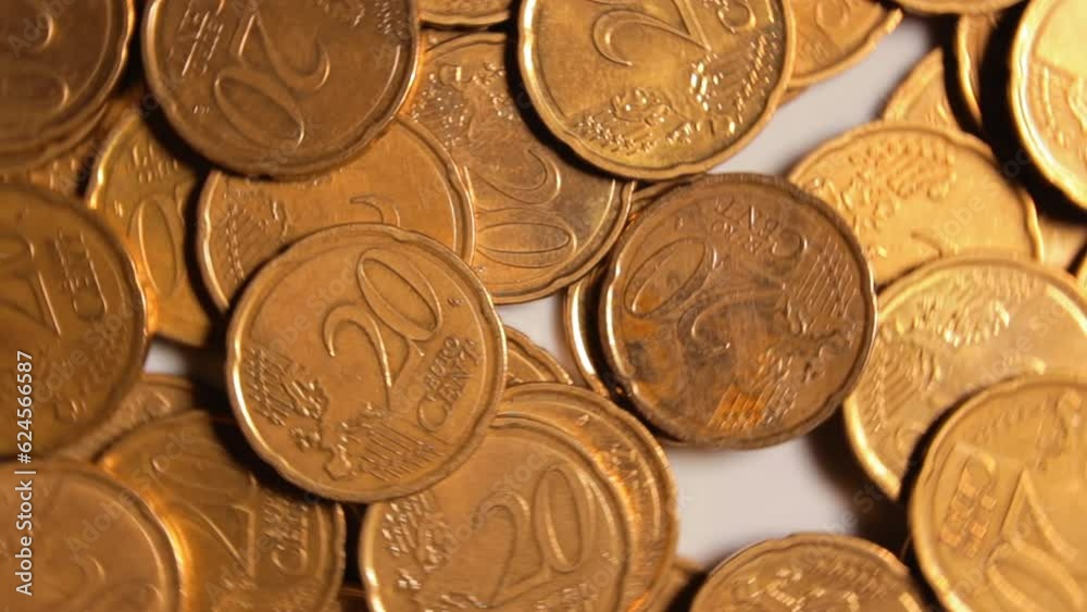 Scattered 20 Euro Cent Coins, Rotating Money Background - Top View. Euro Money Currency. A Lot of Twenty Cent Cash. Golden Eurocents. Business, Finances and Money Saving Concept - Rotation Left Scattered 20 Euro Cent Coins, Rotating Money Background - Top View. Euro Money Currency. A Lot of Twenty Cent Cash. Golden Eurocents. Business, Finances and Money Saving Concept - Rotation Left