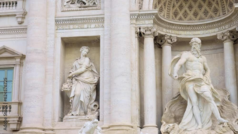 Detail in Low angle of exterior of Trevi fountain with amazing facade, architecture and sculptures in old city with clean water under cloudy sky, Rome, Italy Detail in Low angle of exterior of Trevi fountain with amazing facade, architecture and sculptures in old city with clean water under cloudy sky, Rome, Italy