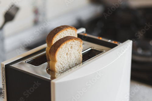 Modern toaster ready to toast white bread for a delicious breakfast.