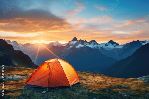 Tourist tent in the mountains at dawn in the summer