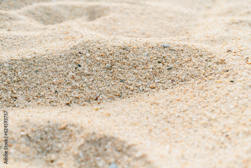 Close-up of sand on the beach in the summer time.