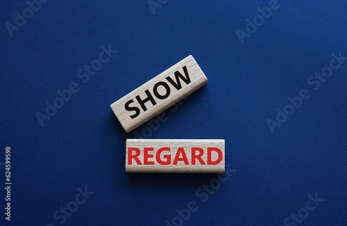 Show regard symbol. Wooden blocks with words Show regard. Beautiful deep blue background. Business and Show regard concept. Copy space.