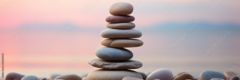 Zen stone tower with peaceful sea and sky bokeh Zen stone tower with peaceful sea and sky bokeh
