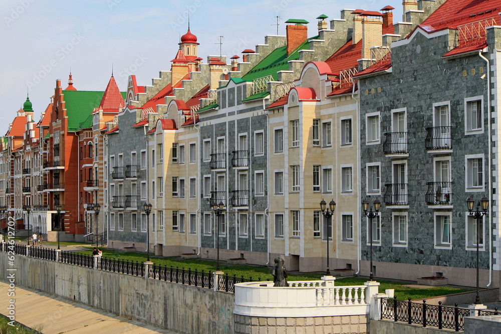 Yoshkar-Ola, Republic of Mari El, Russia - 08.20.2021. Buildings on the Bruges embankment