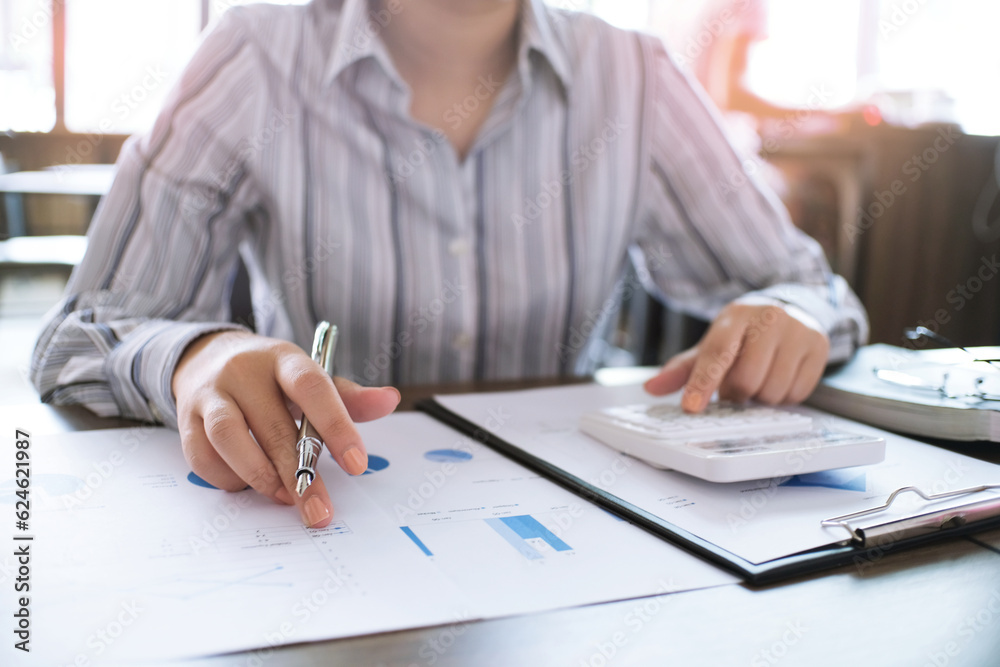 Financial inspector making report, calculating or checking balance. Business Audit concept Financial inspector making report, calculating or checking balance. Business Audit concept