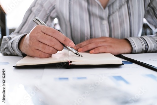 Business woman analyzing investment charts and pressing calculator buttons over documents. Accounting Concept.