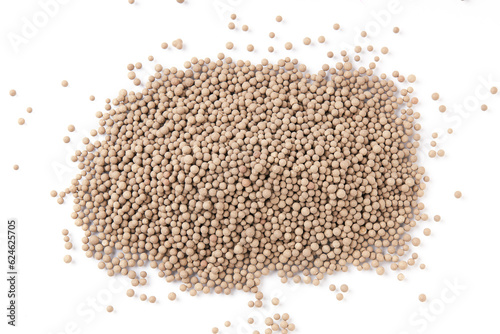 Top view of dried silica gel granules, coarse grained brown granules scattered isolated on white background.