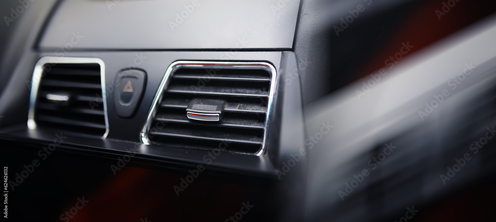 The process of choosing climate control in the car. Various controls in auto switches. Modern car interior