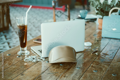 notebook, laptop and phone, headphones, cocktail, sunglasses in table, Pretty Young Beauty Woman Using Laptop in cafe, outdoor portrait business woman, hipster style, internet, smartphone, office, Bal
