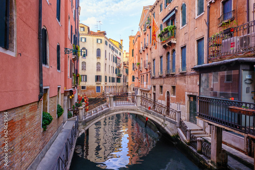 Venice, Italy - June 22, 2023: Canal, bridge and ancient houses of Venice © Leonid