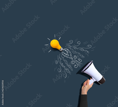 Wallpaper Mural Attention and announcement concept with an idea light bulb flying to the sky lik