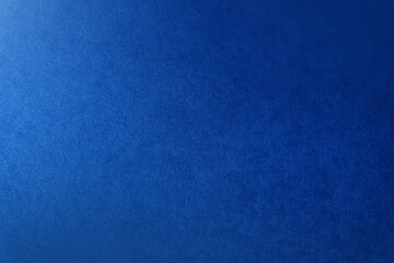 Rough texture of classic solid navy blue tone color paint on environmental friendly cardboard box blank paper texture background with space and minimal design grunge style
