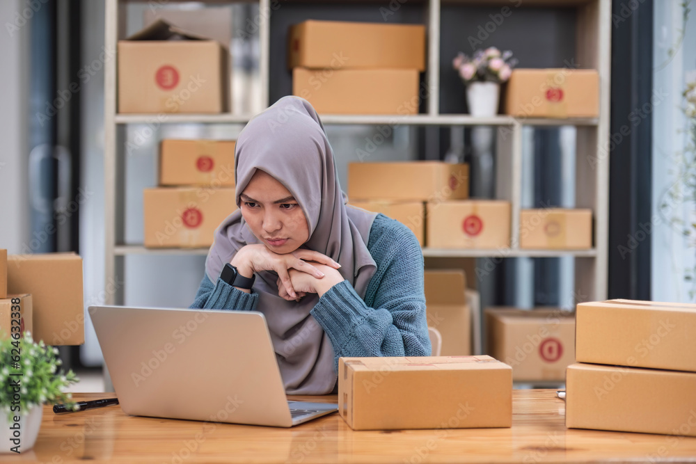 Stressed Muslim online business owner feeling upset and unhappy about the sale and orders Stressed Muslim online business owner feeling upset and unhappy about the sale and orders