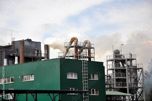 Smoke from chimneys in a modern industrial plant. Environmental pollution.