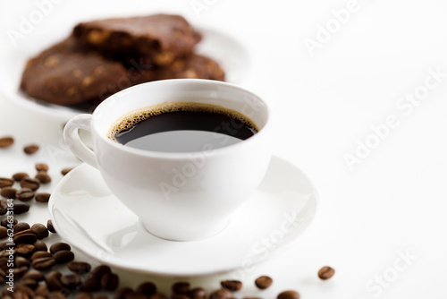 Coffee cup and beans on white background.