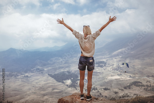 Happy woman in the mountains