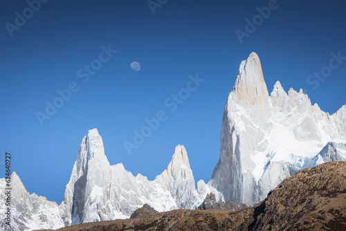 snowy fitzroy peak in autumn with the moon photo