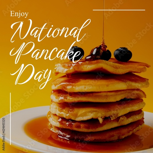Enjoy national pancake day text in white over pancake stack with blueberries and pouring syrup
