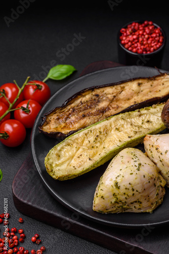 Delicious grilled vegetables zucchini, eggplant, peppers and mushrooms with salt, spices and herbs